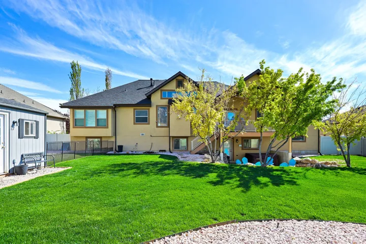Back of property with stairway and stucco siding