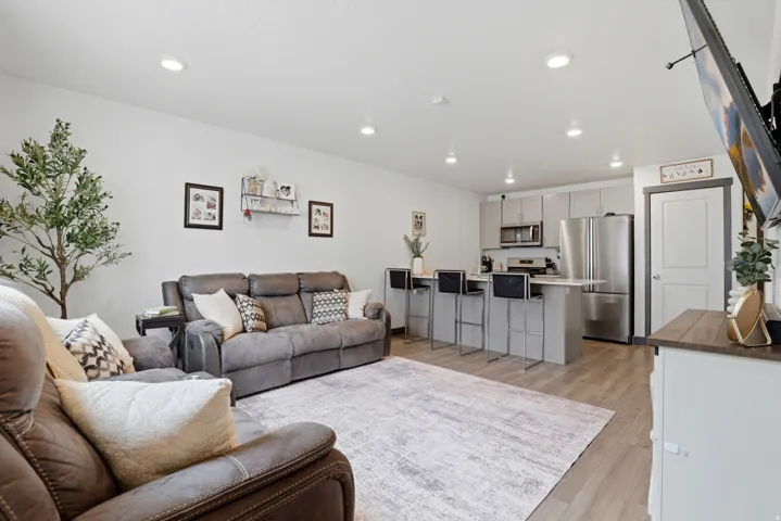 Living area featuring recessed lighting and light wood-style floors