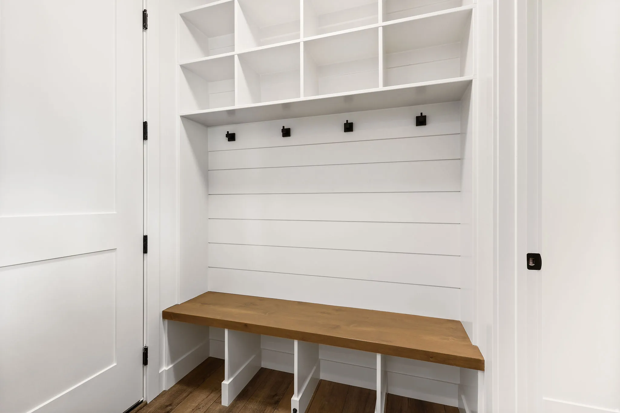 Mudroom with dark wood-type flooring