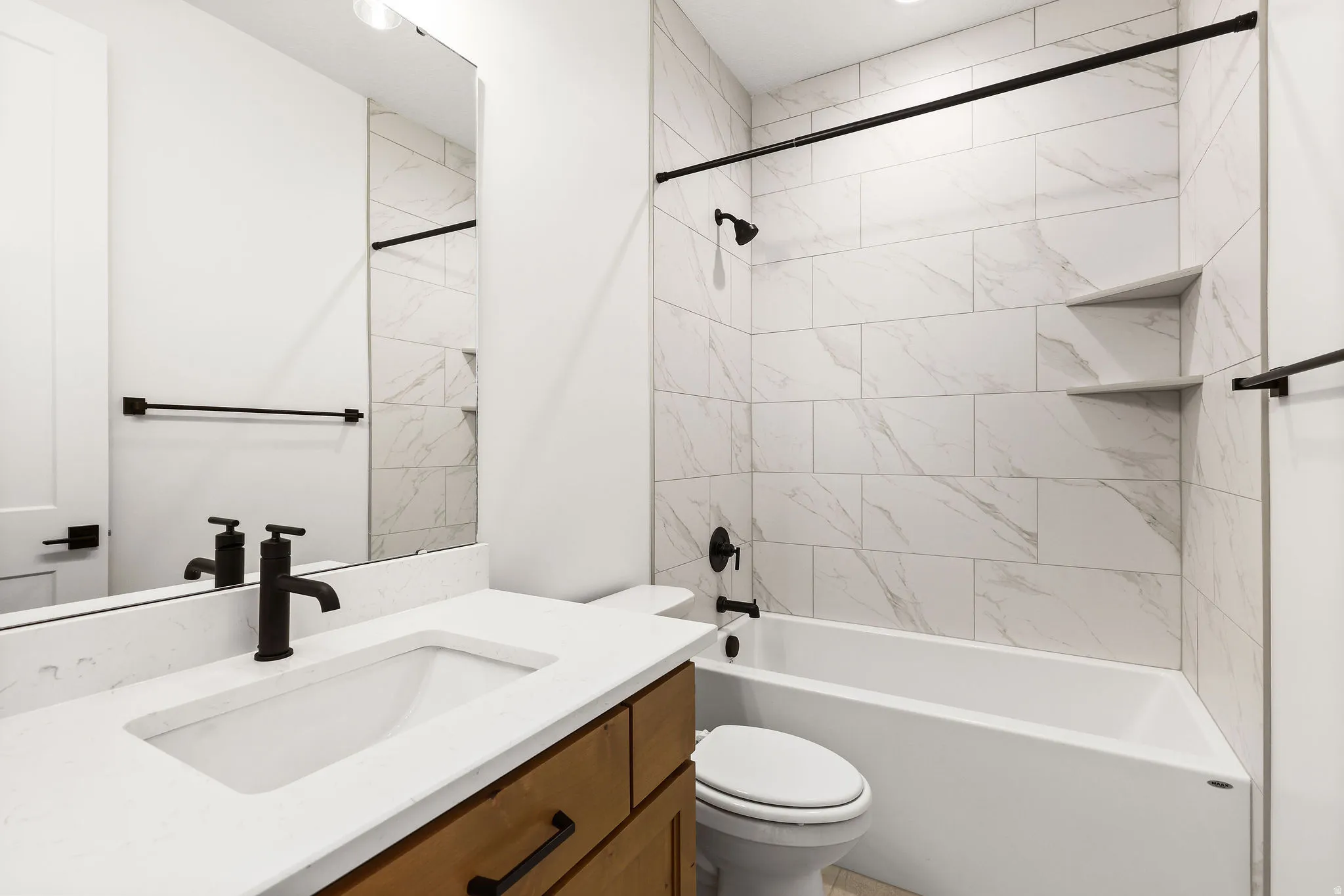 Full bath with vanity and tub / shower combination
