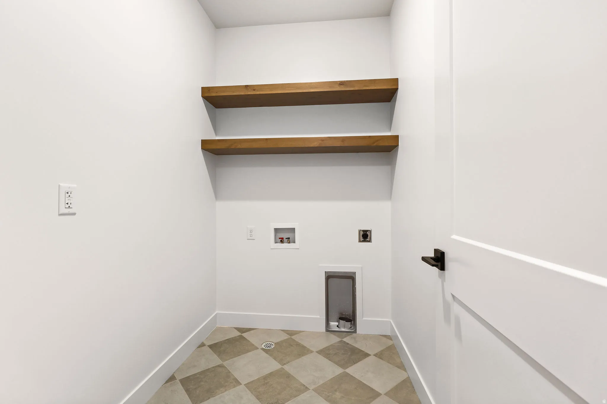 Laundry area with electric dryer hookup, light flooring, and washer hookup