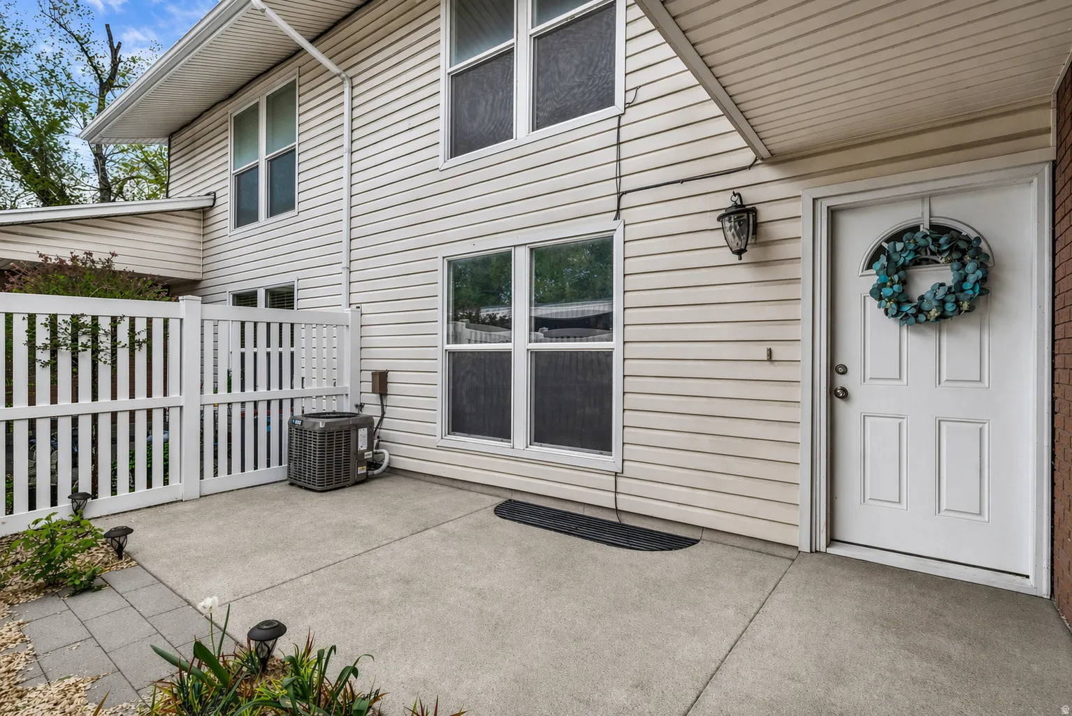 View of exterior entry featuring a patio area