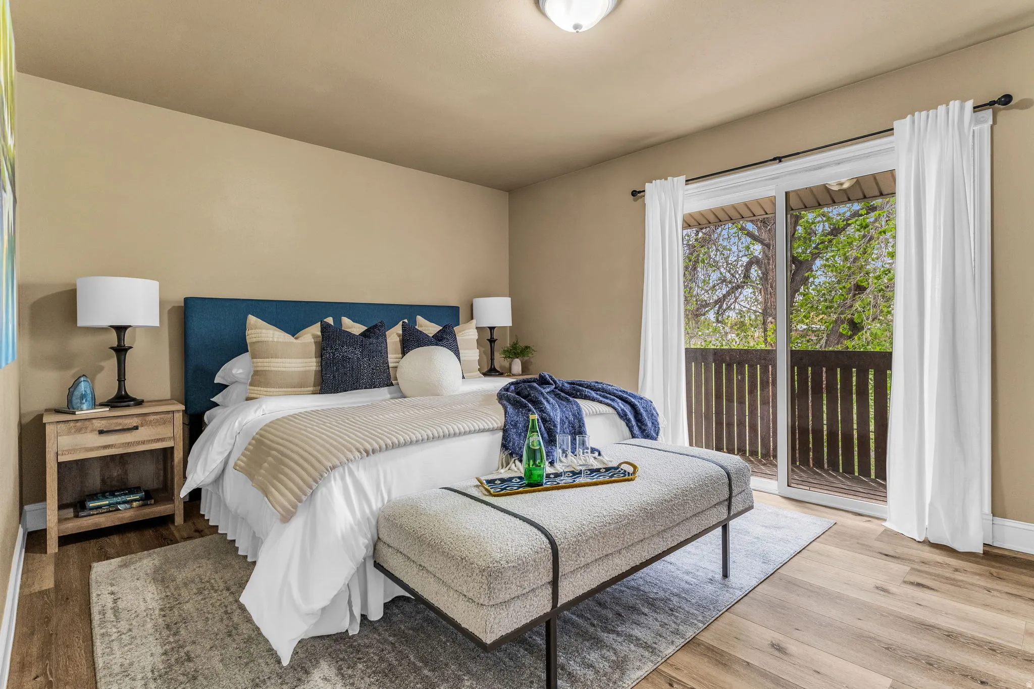 Bedroom with access to outside and wood finished floors