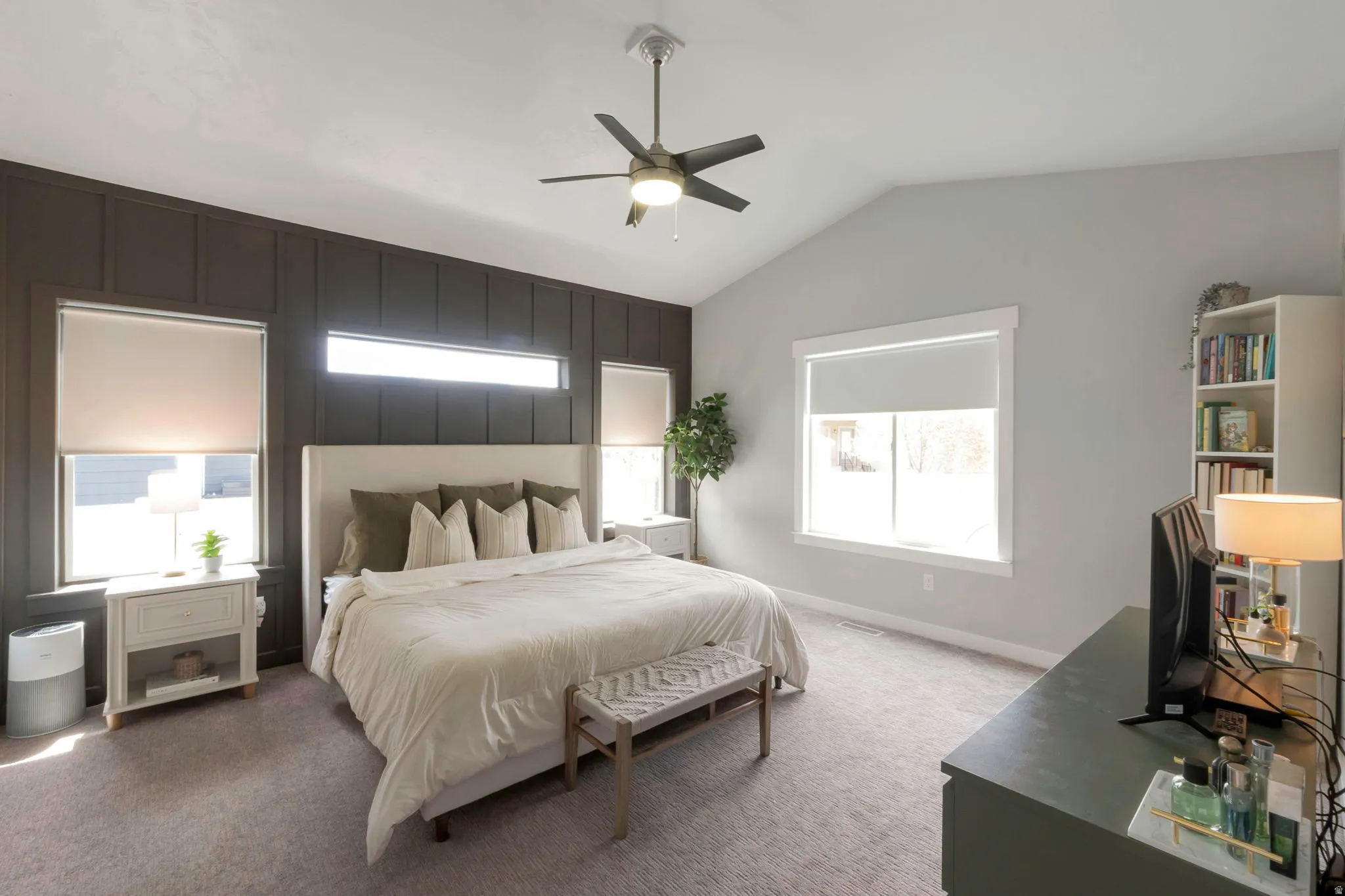 Bedroom featuring lofted ceiling, carpet floors, and a ceiling fan
