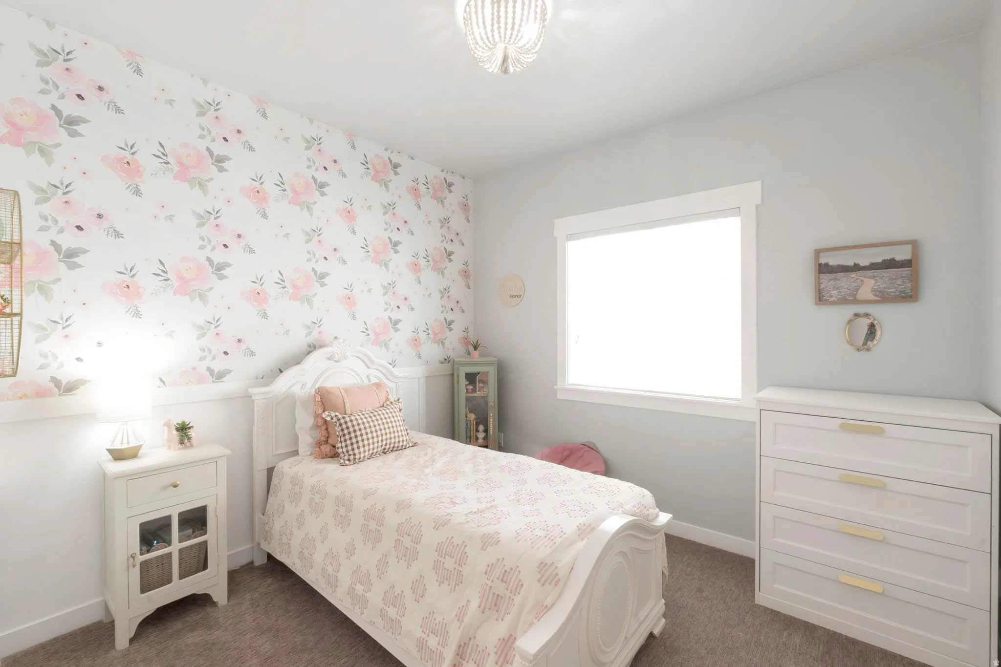 Bedroom featuring dark carpet and wallpapered walls