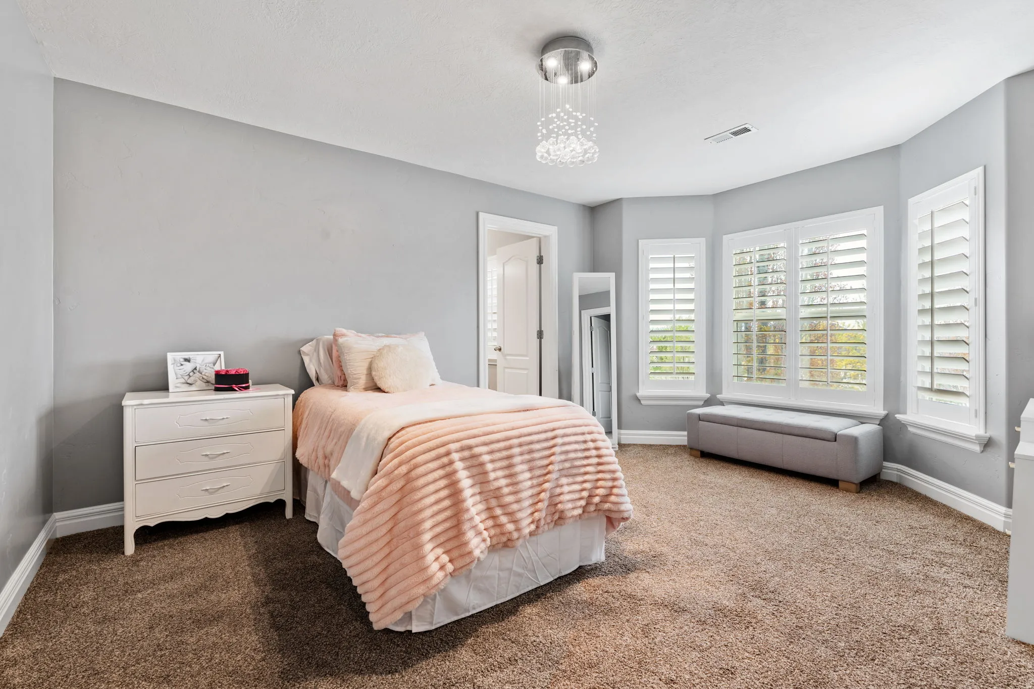 Carpeted bedroom featuring baseboards