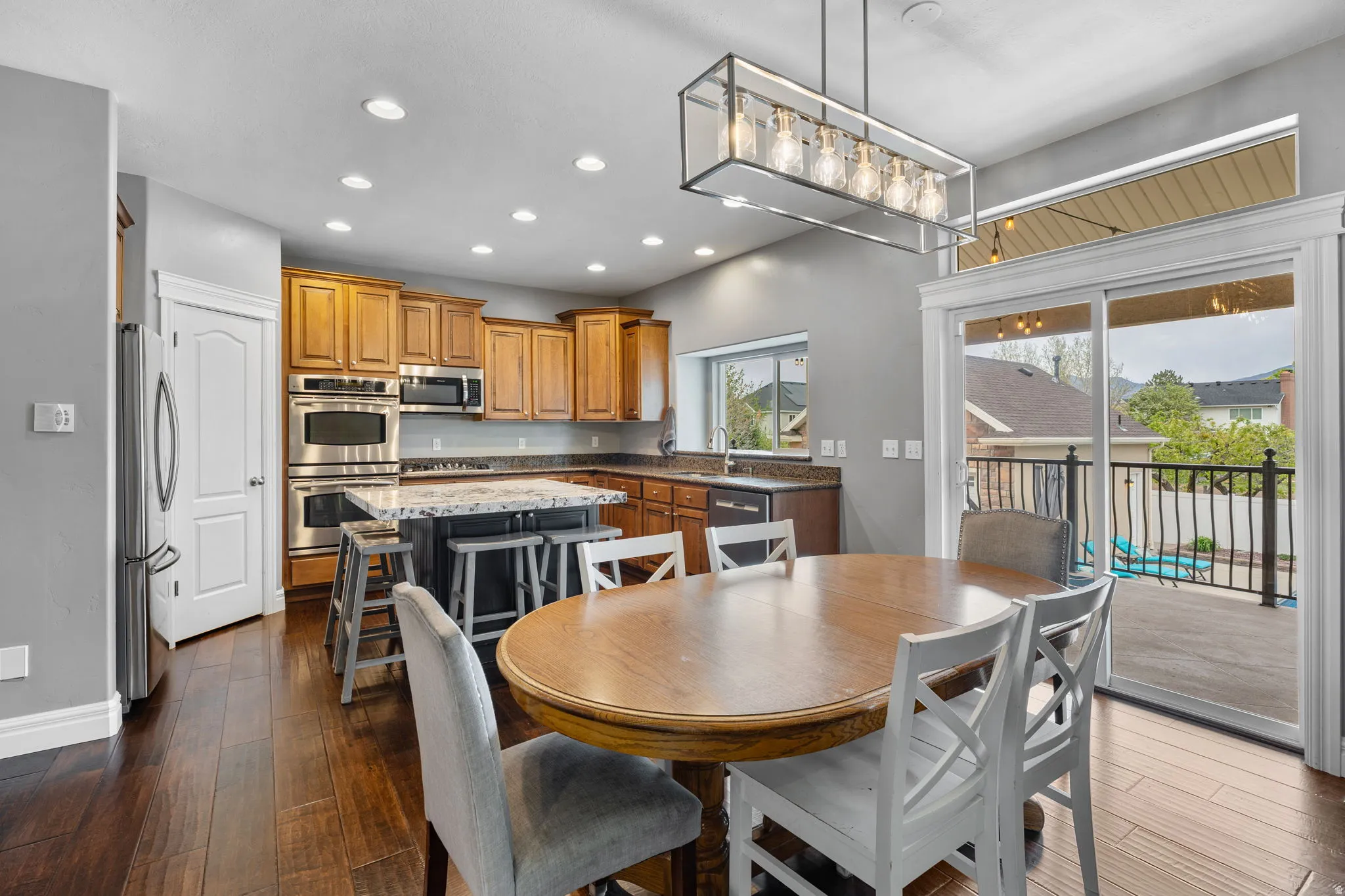Dining area featuring recessed lighting and dark wood finished floors