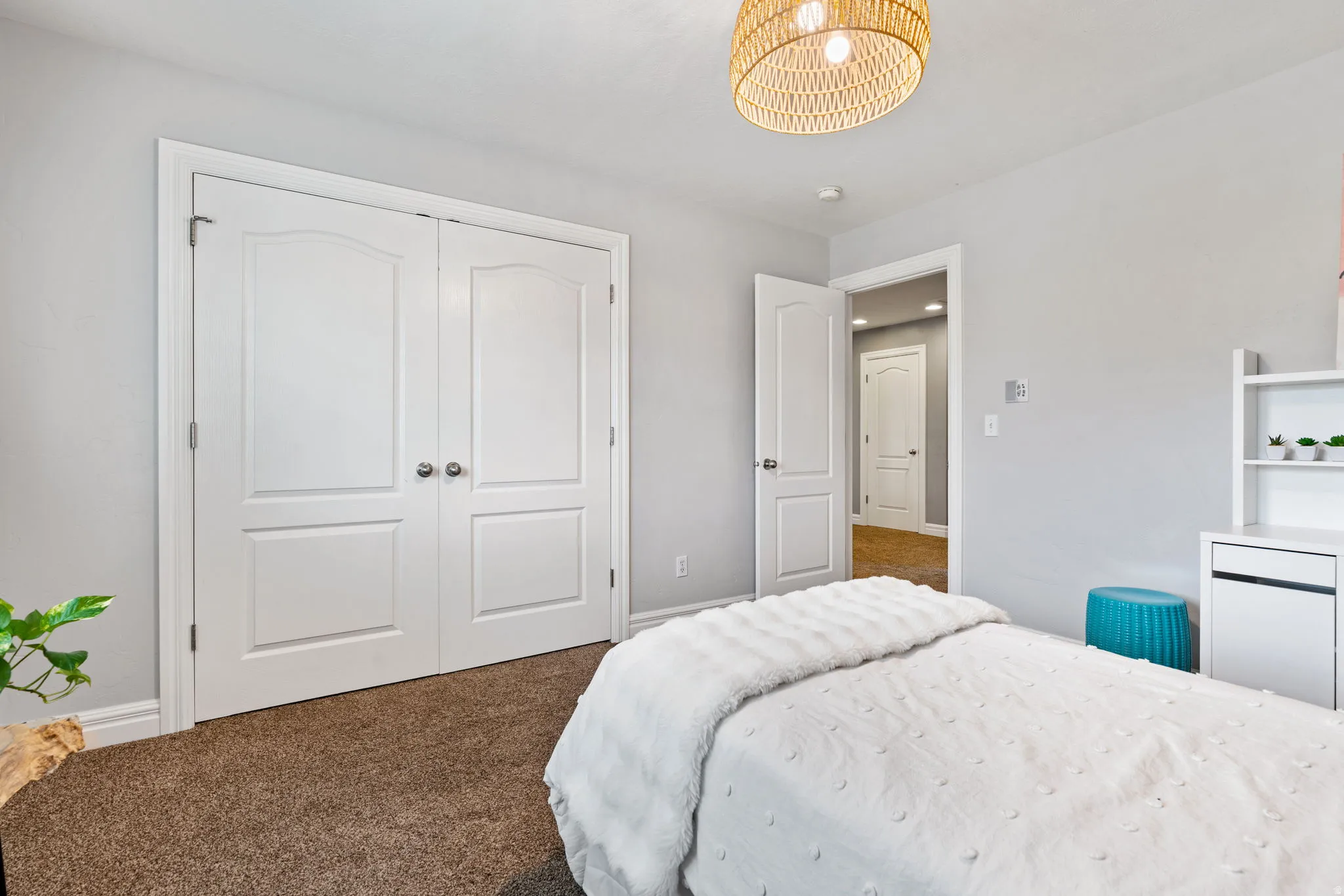 Bedroom with carpet floors and a closet