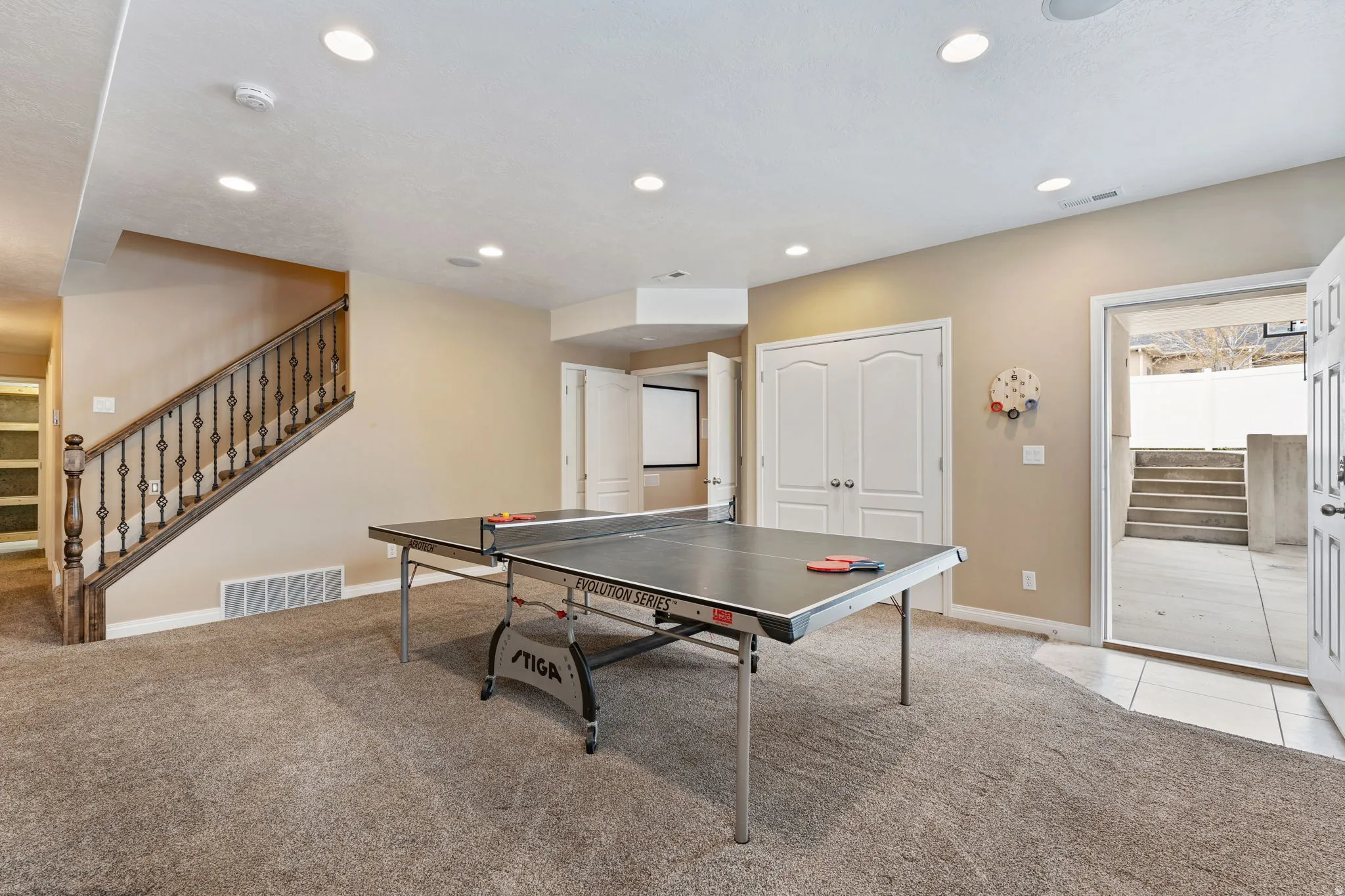 Playroom with light colored carpet and recessed lighting