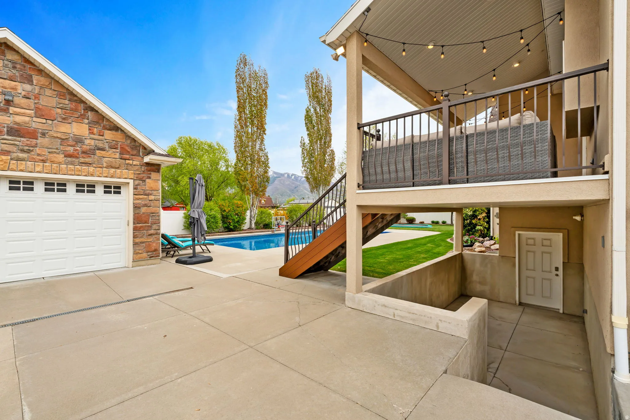 View of pool featuring patio surround and a mountain view