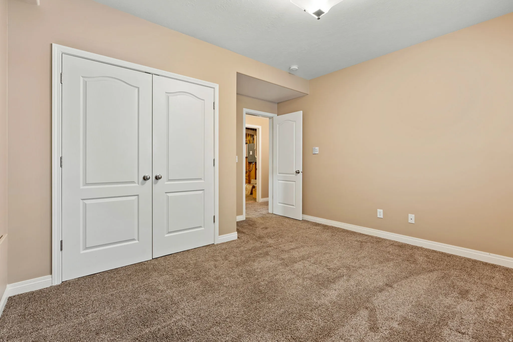 Unfurnished bedroom with a closet and carpet flooring