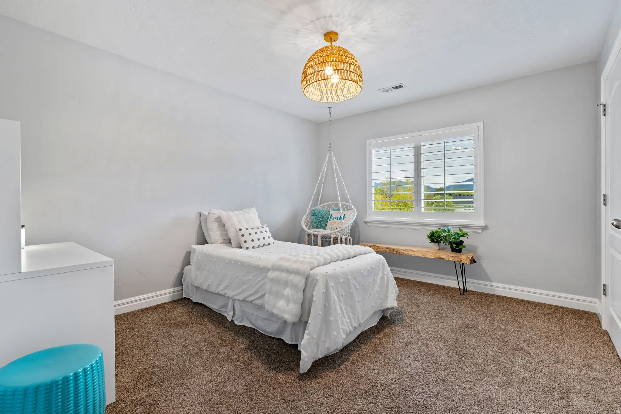 Bedroom with baseboards and carpet