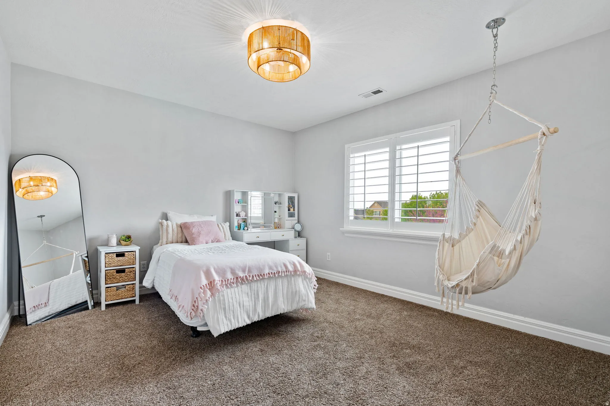 Bedroom with carpet floors and baseboards