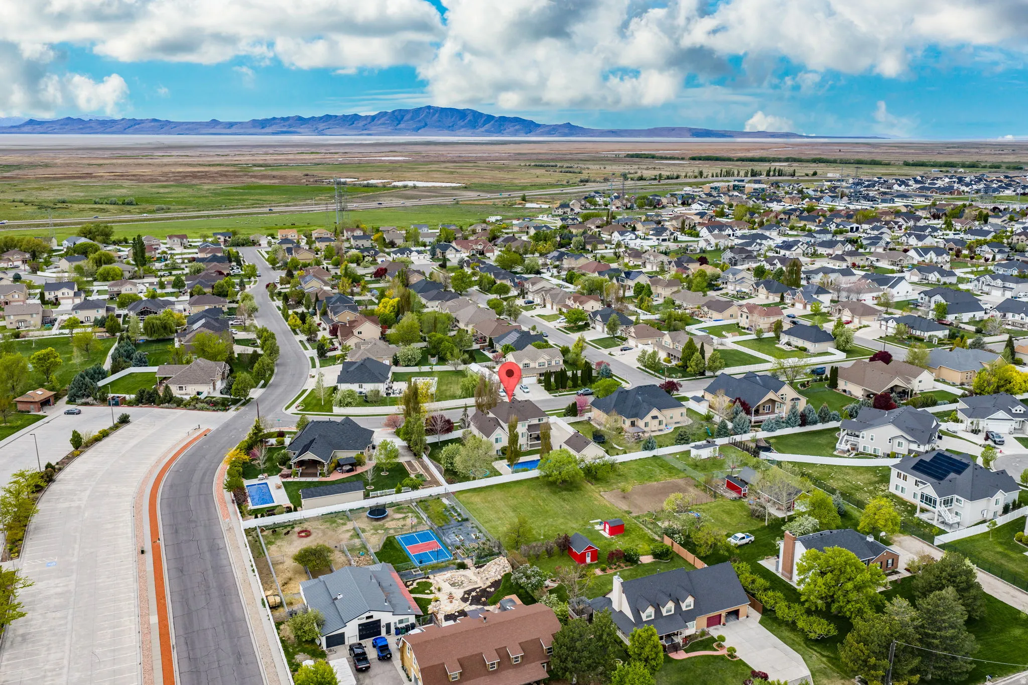 Aerial perspective of suburban area with a mountain backdrop