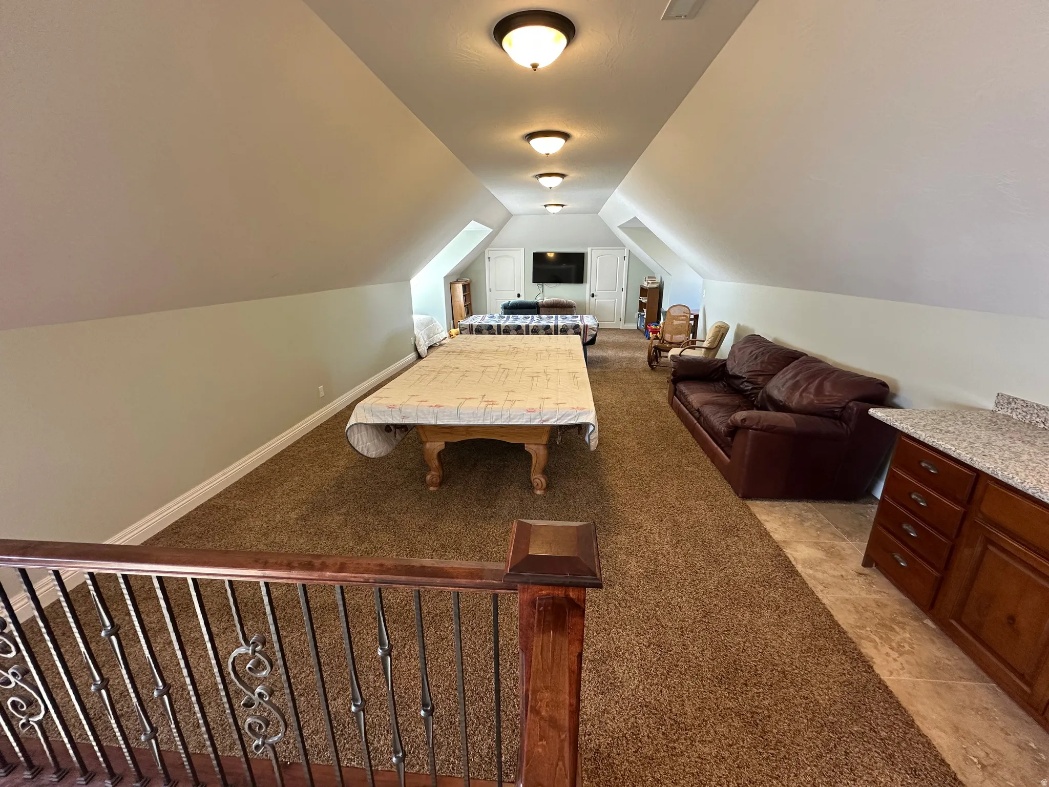 Game room featuring light colored carpet and baseboards