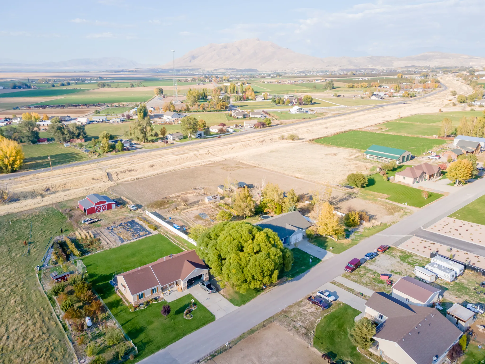 Aerial view of property's location featuring nearby suburban area and rural landscape