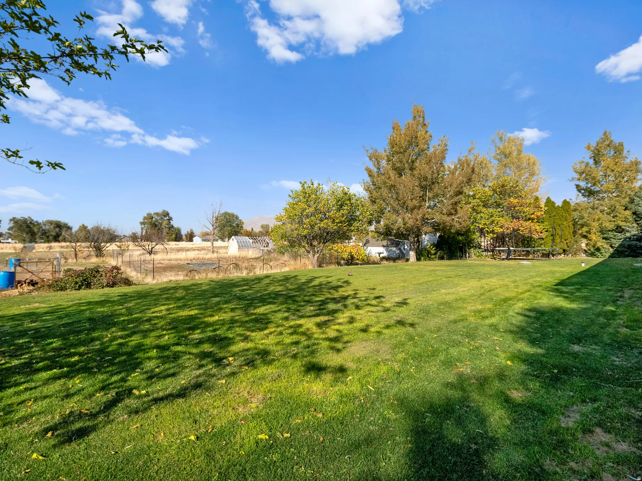 View of green lawn featuring a view of rural / pastoral area