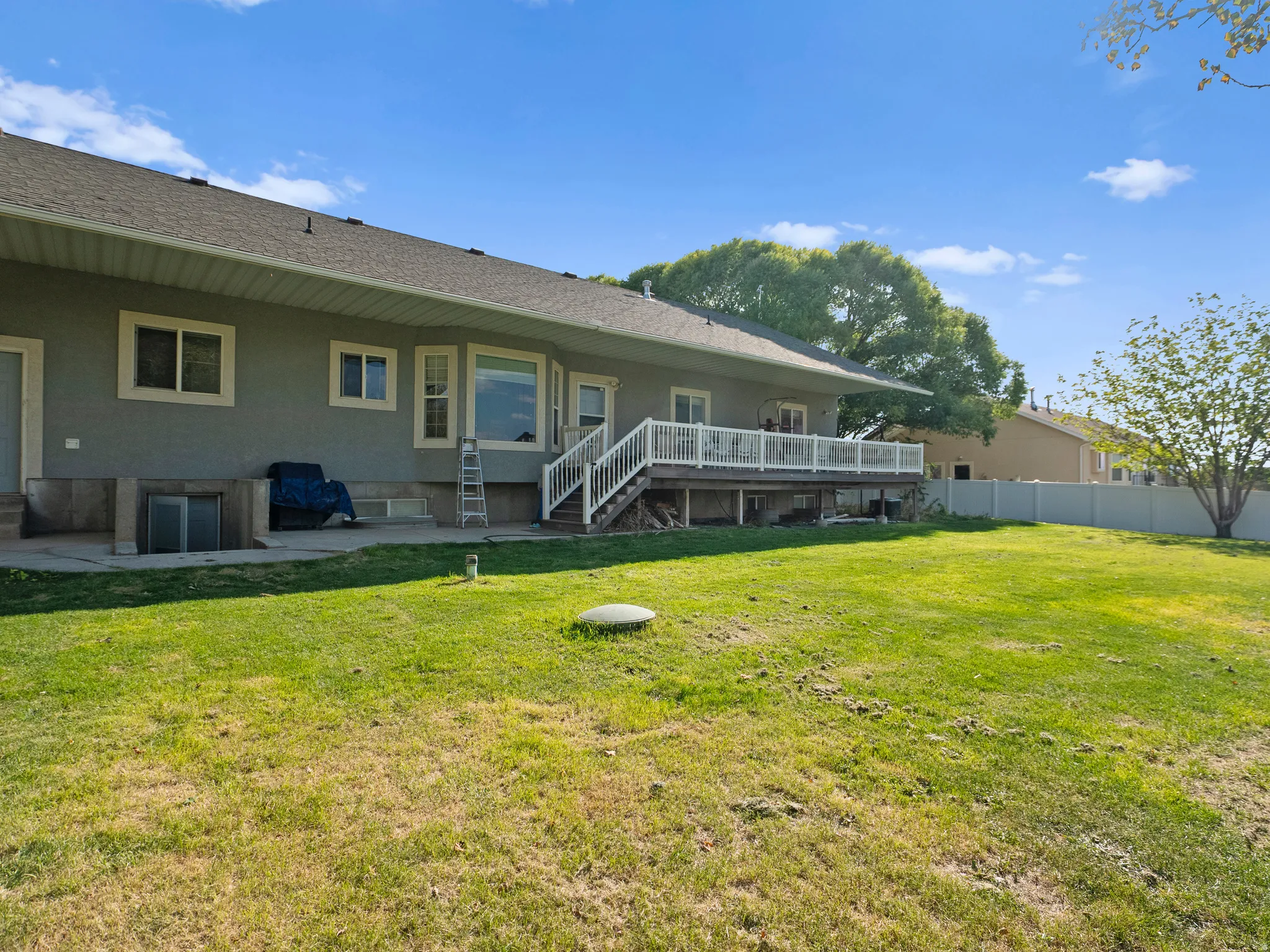 Back of property with a patio area and a wooden deck