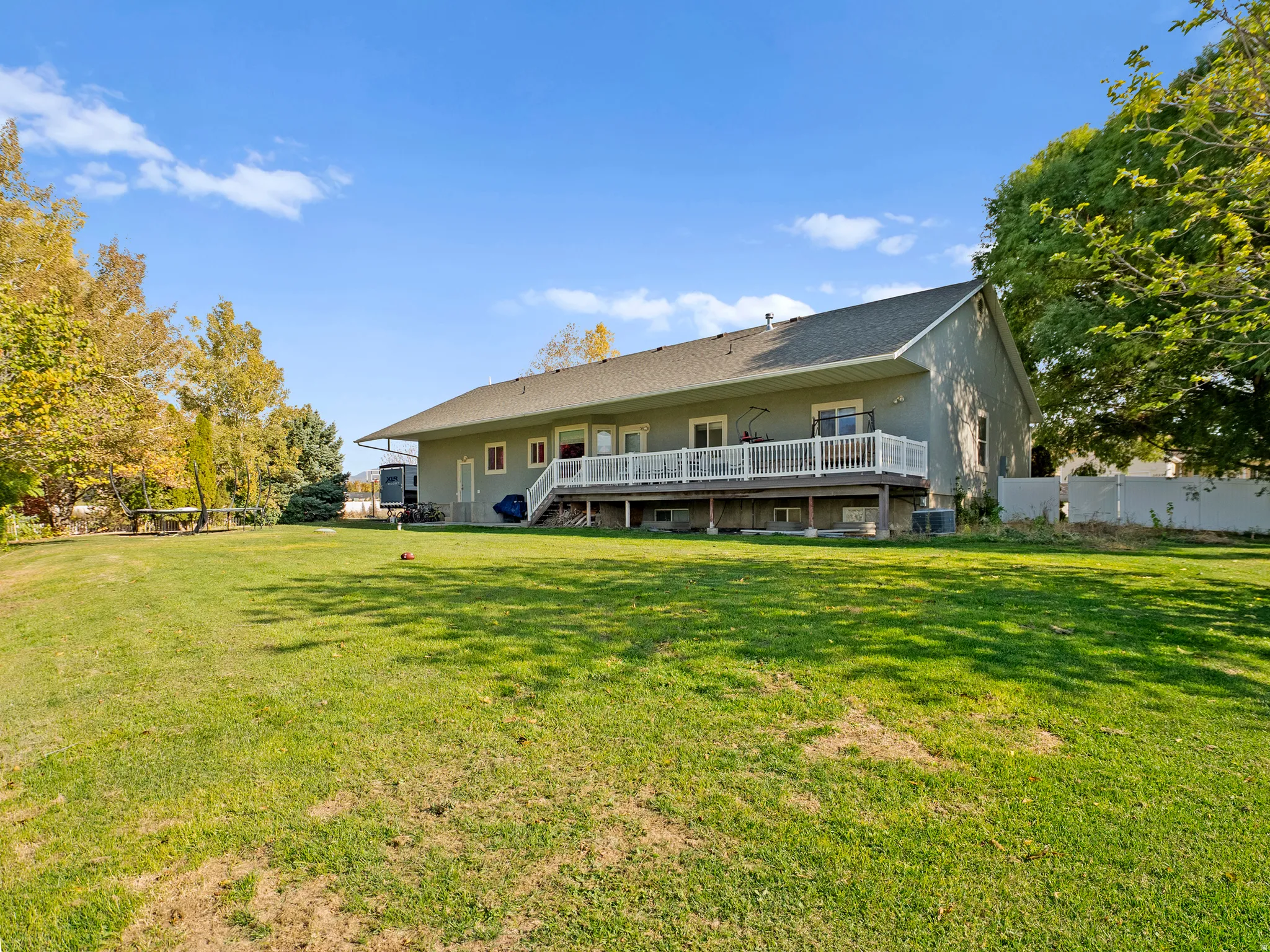 Back of house featuring a wooden deck