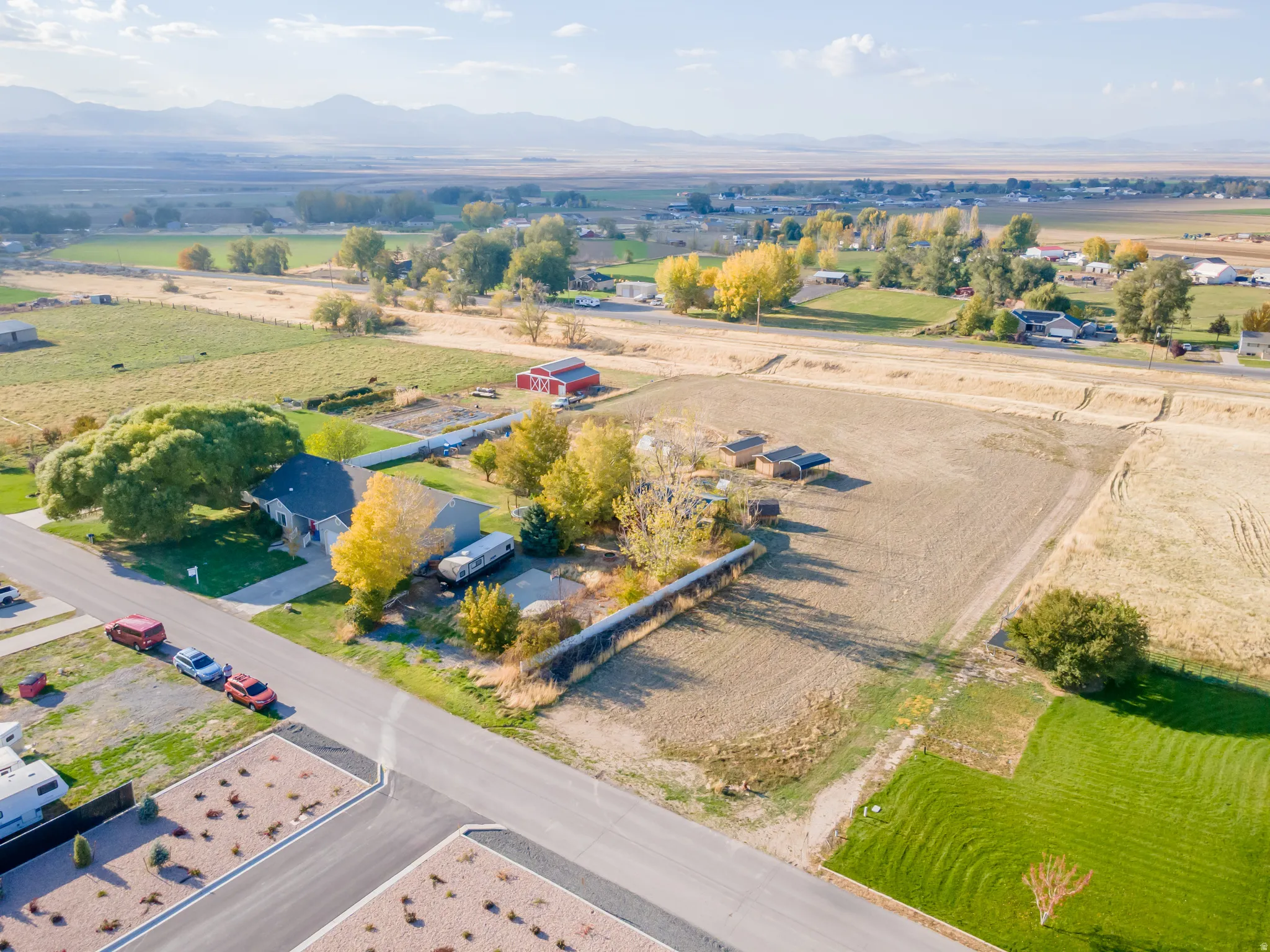 Overview of rural landscape featuring a mountainous background