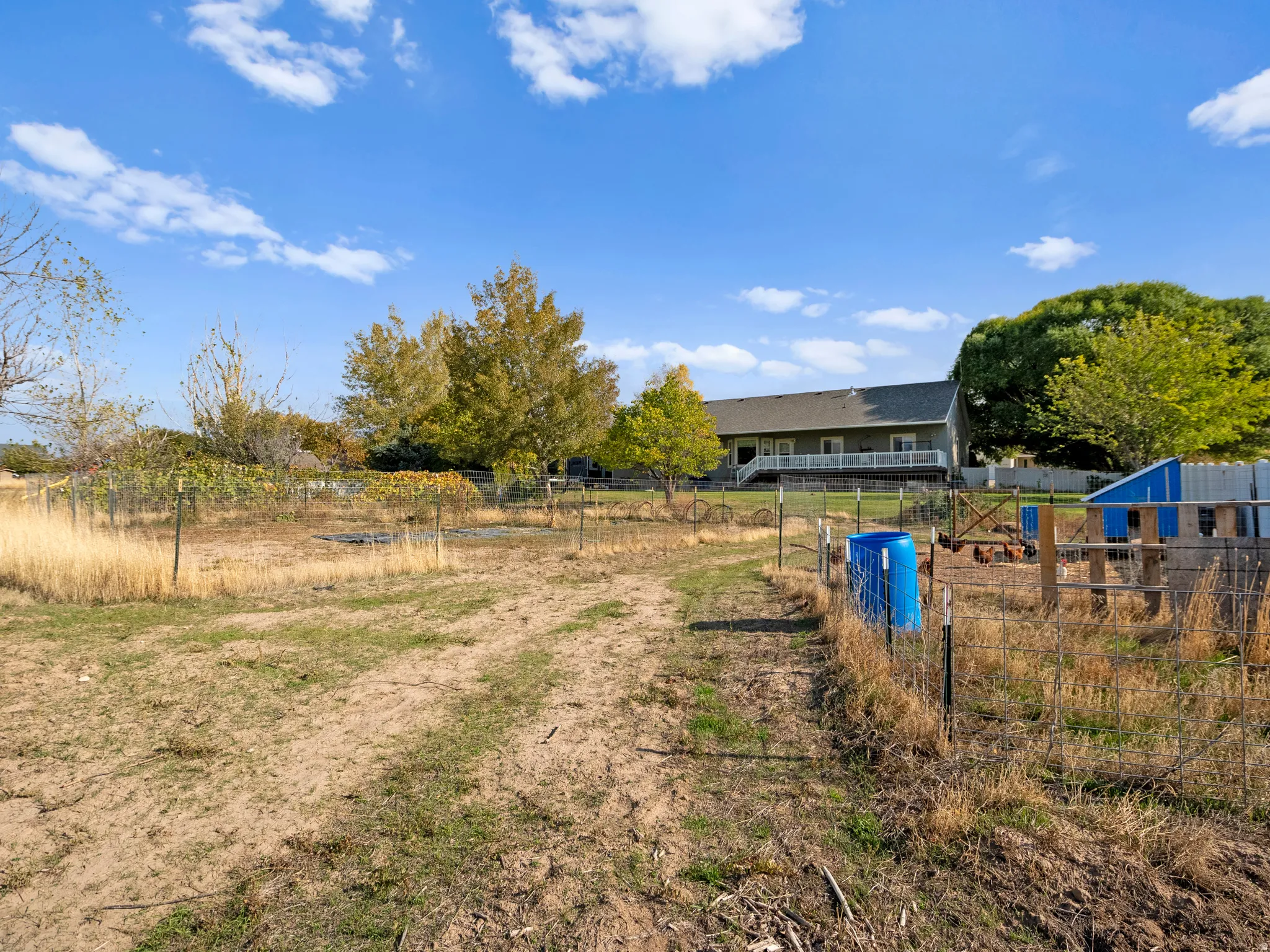 View of yard featuring a view of countryside and an outbuilding