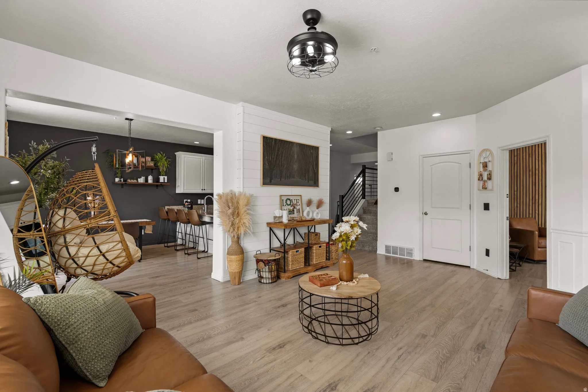 Living room with wood finished floors and recessed lighting