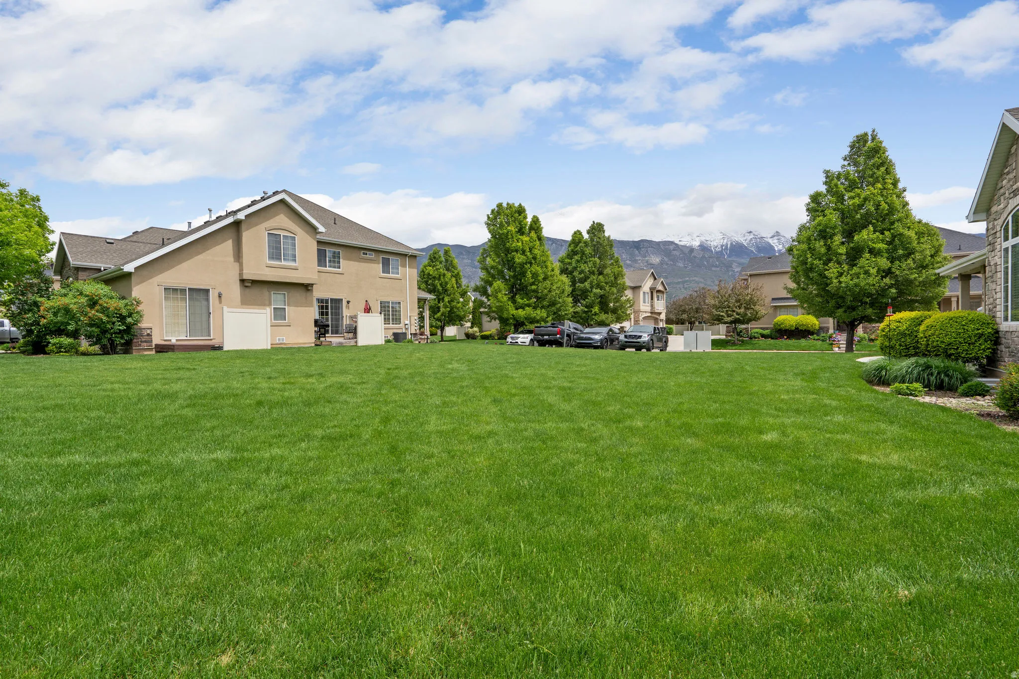 View of grassy yard featuring a mountain view