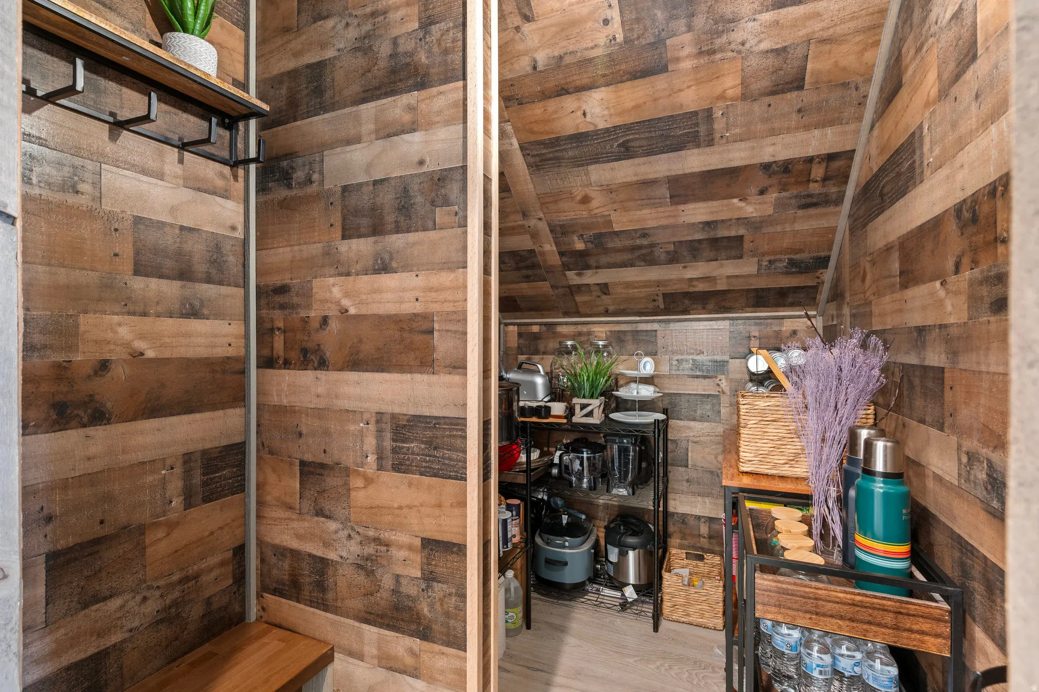 Bathroom with wooden walls and vaulted ceiling