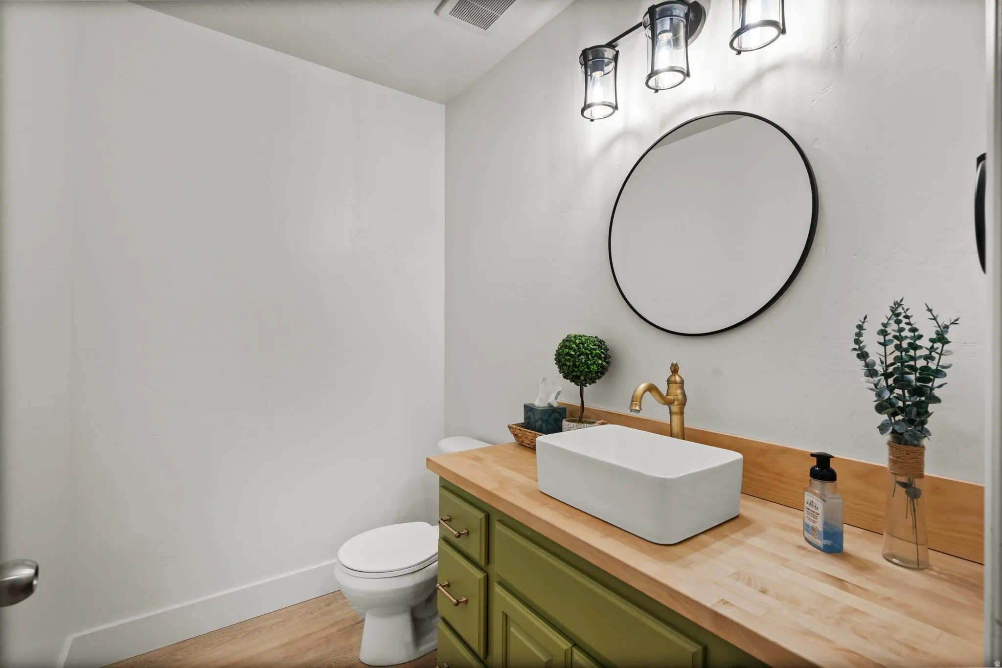 Bathroom with vanity and light wood-type flooring