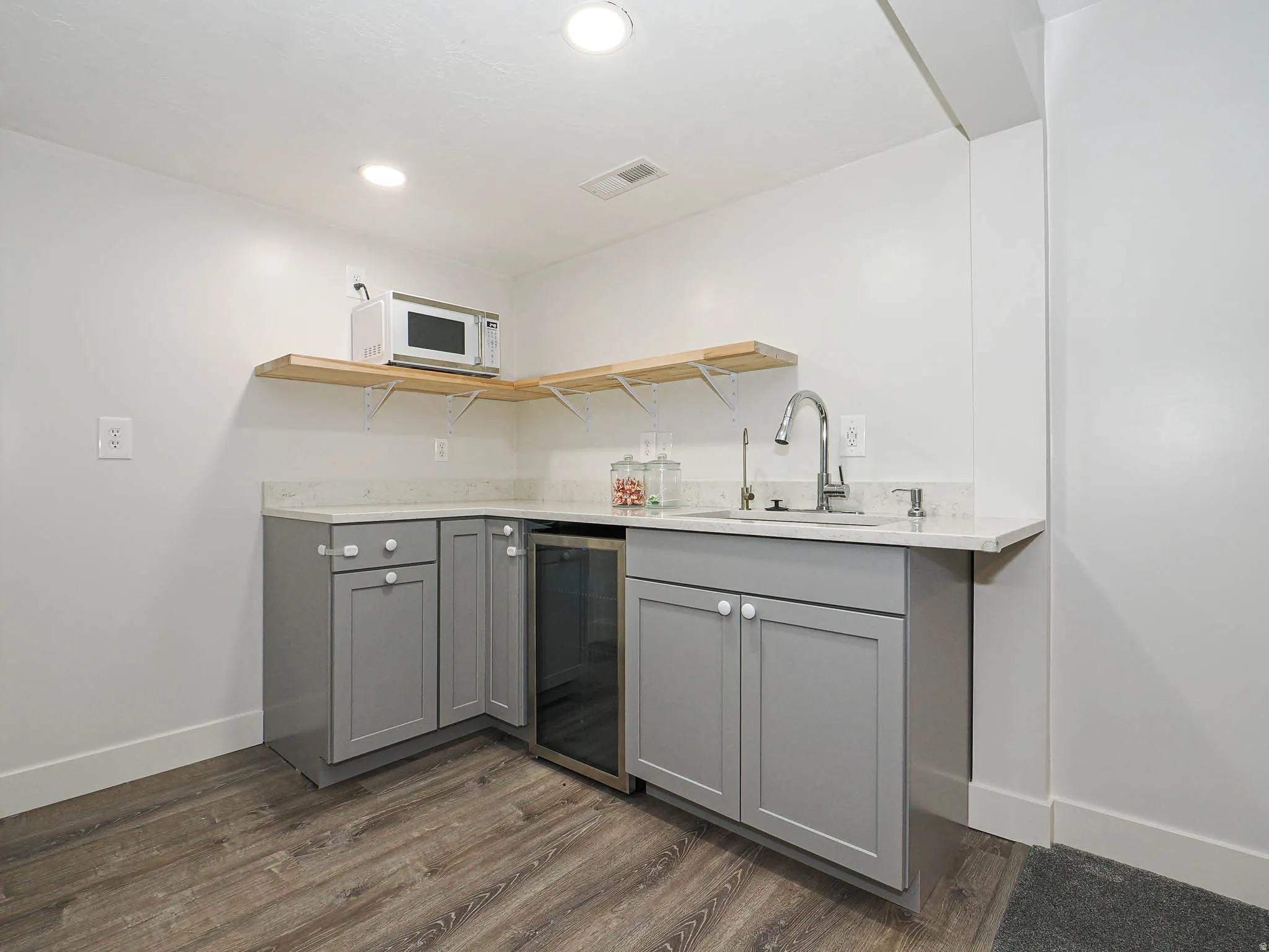 Wetbar with drink fridge & sink with disposal