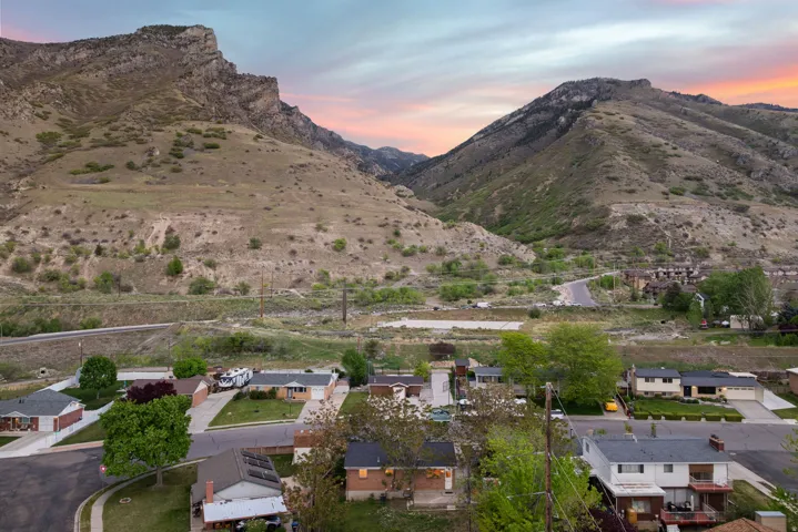 View of mountain backdrop with nearby suburban area