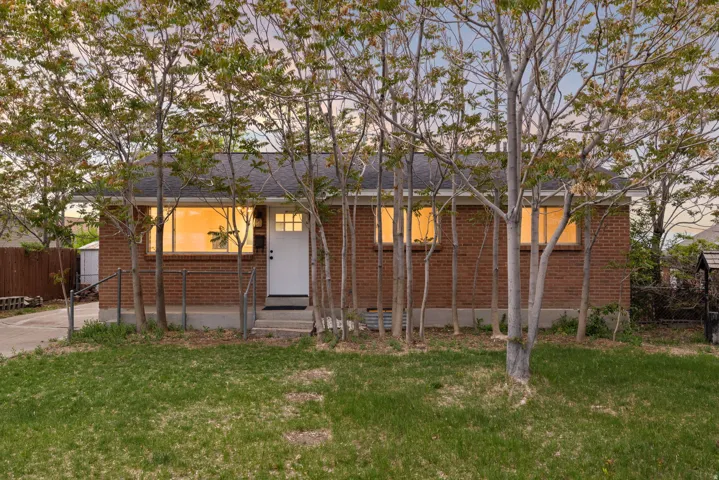 Ranch-style home featuring brick siding