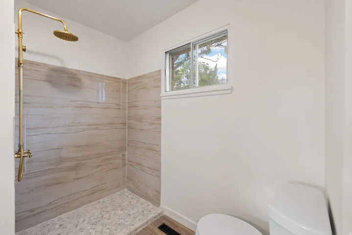 Bathroom featuring a shower stall