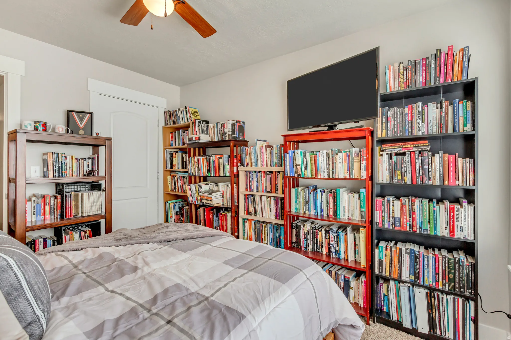 Bedroom featuring carpet floors and a ceiling fan
