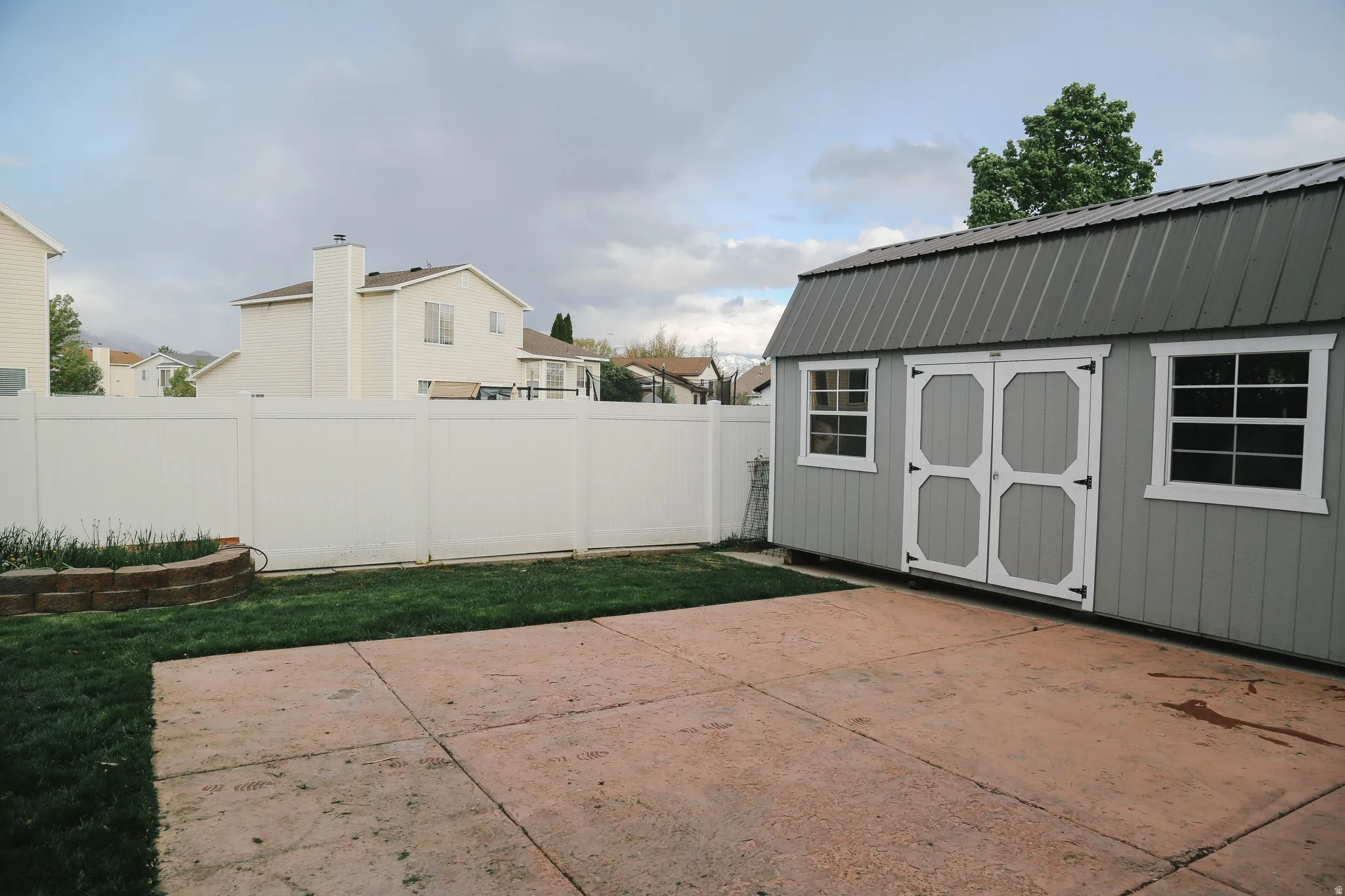 View of shed featuring a fenced backyard