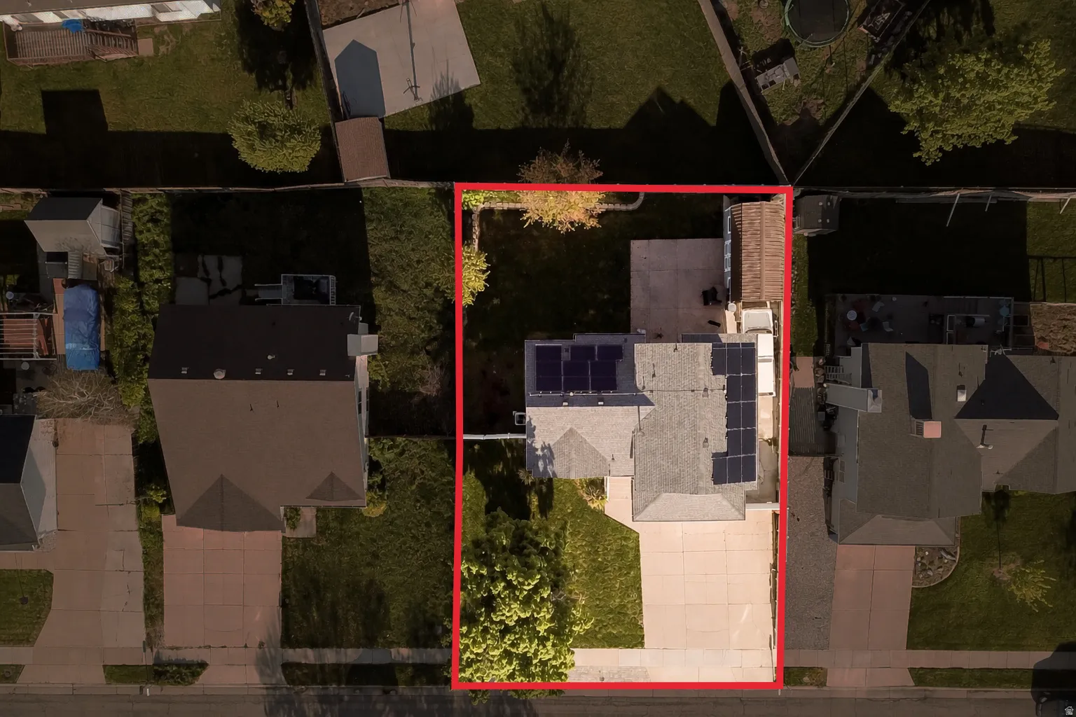 Aerial view of residential area with property boundaries highlighted