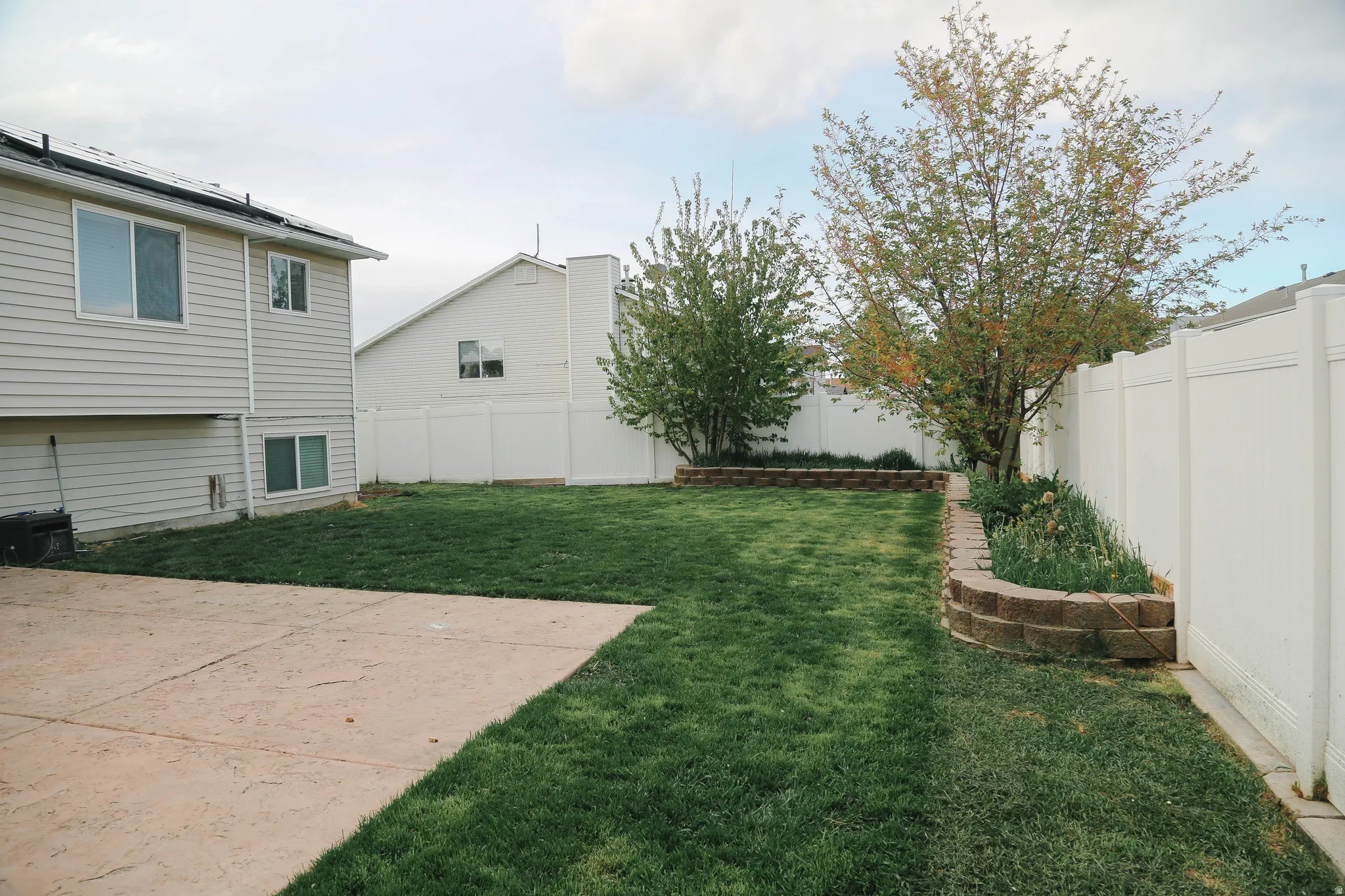 View of fenced backyard