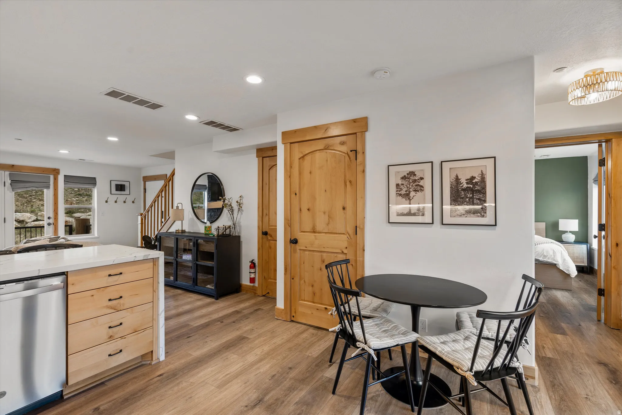 Dining room featuring light wood finished floors and recessed lighting