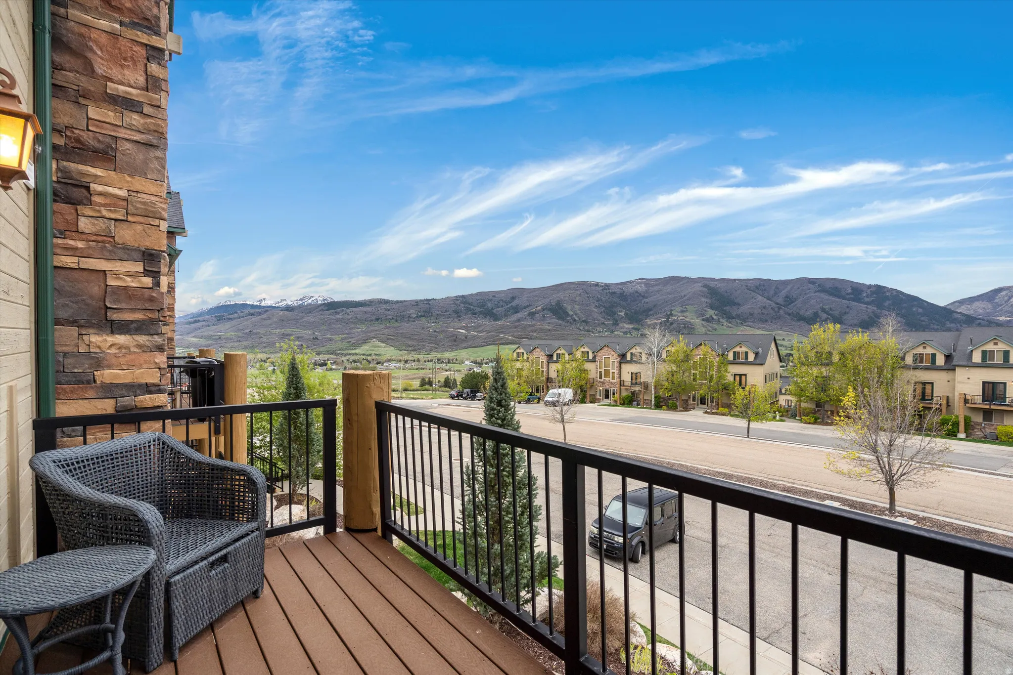 Balcony featuring a residential view and a mountain view