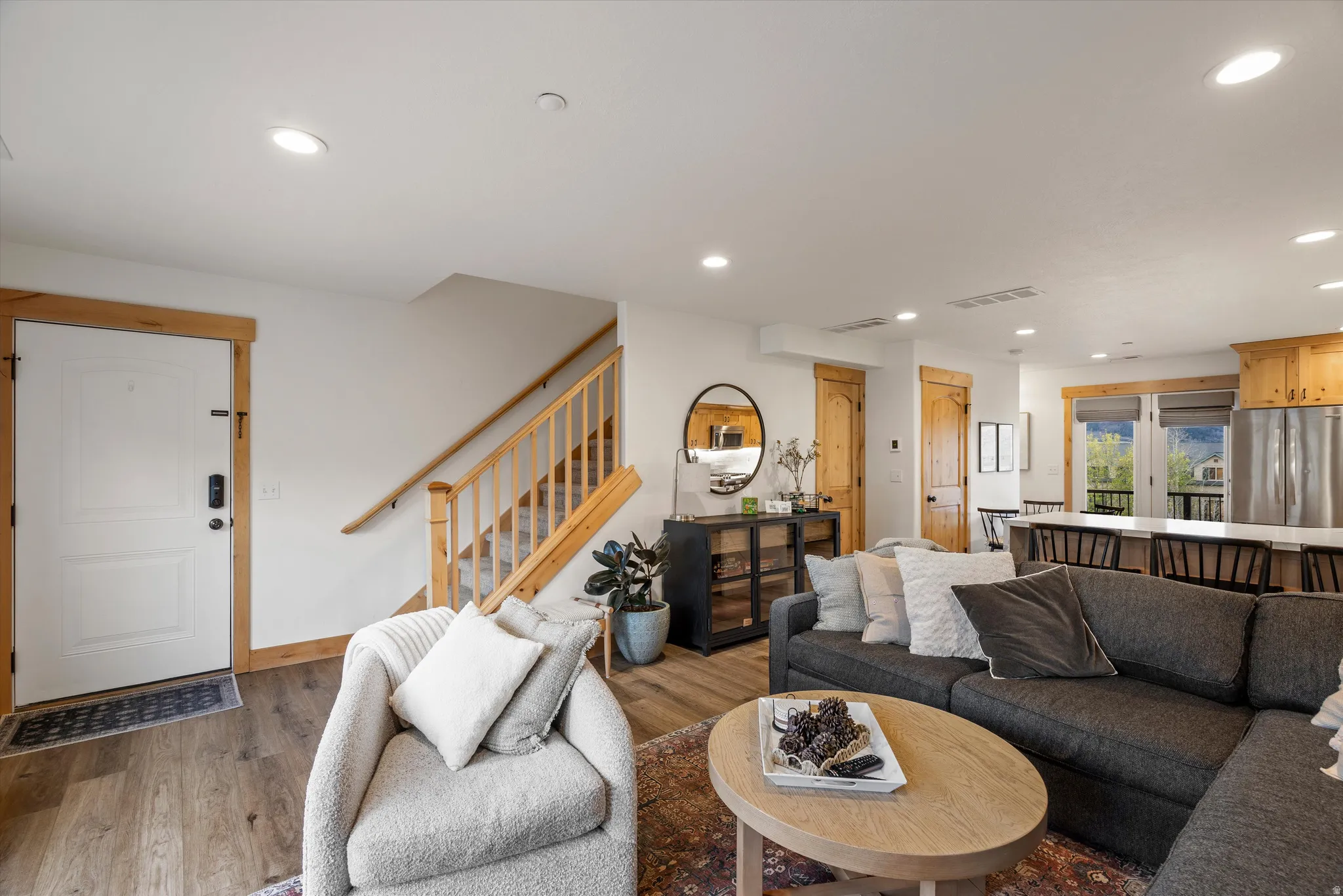 Living room with wood finished floors and recessed lighting