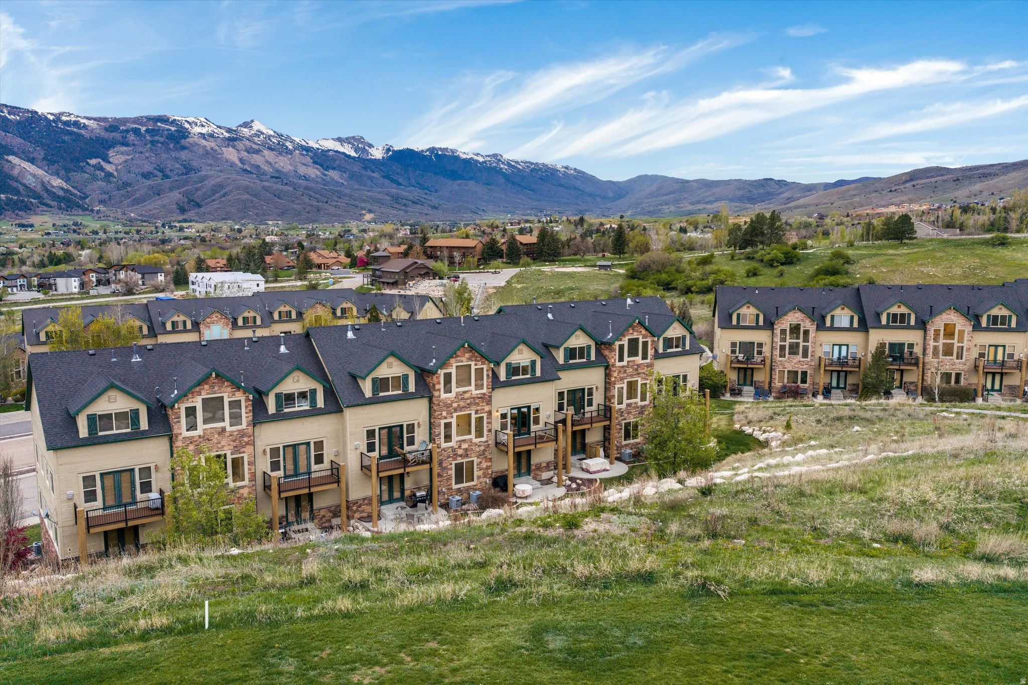 Aerial view of residential area with a mountainous background
