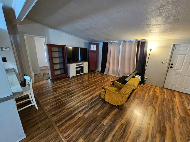 Living area with dark wood-style flooring