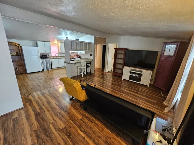 Living room with dark wood finished floors