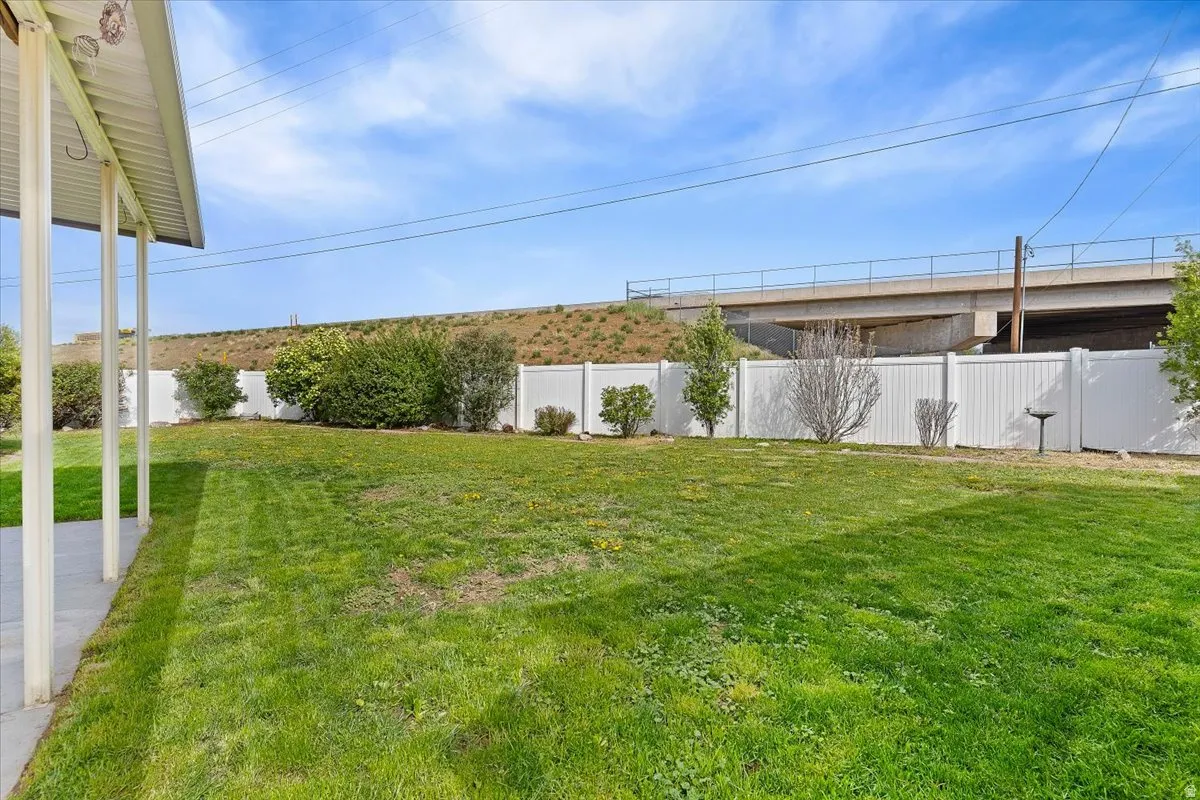 View of fenced backyard