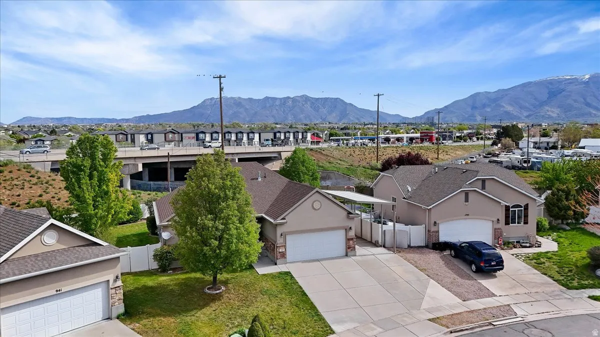 Aerial perspective of suburban area featuring a mountain backdrop