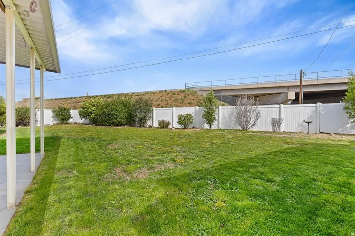 View of fenced backyard