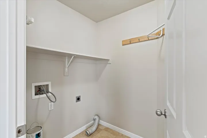 Laundry area with washer hookup and hookup for an electric dryer