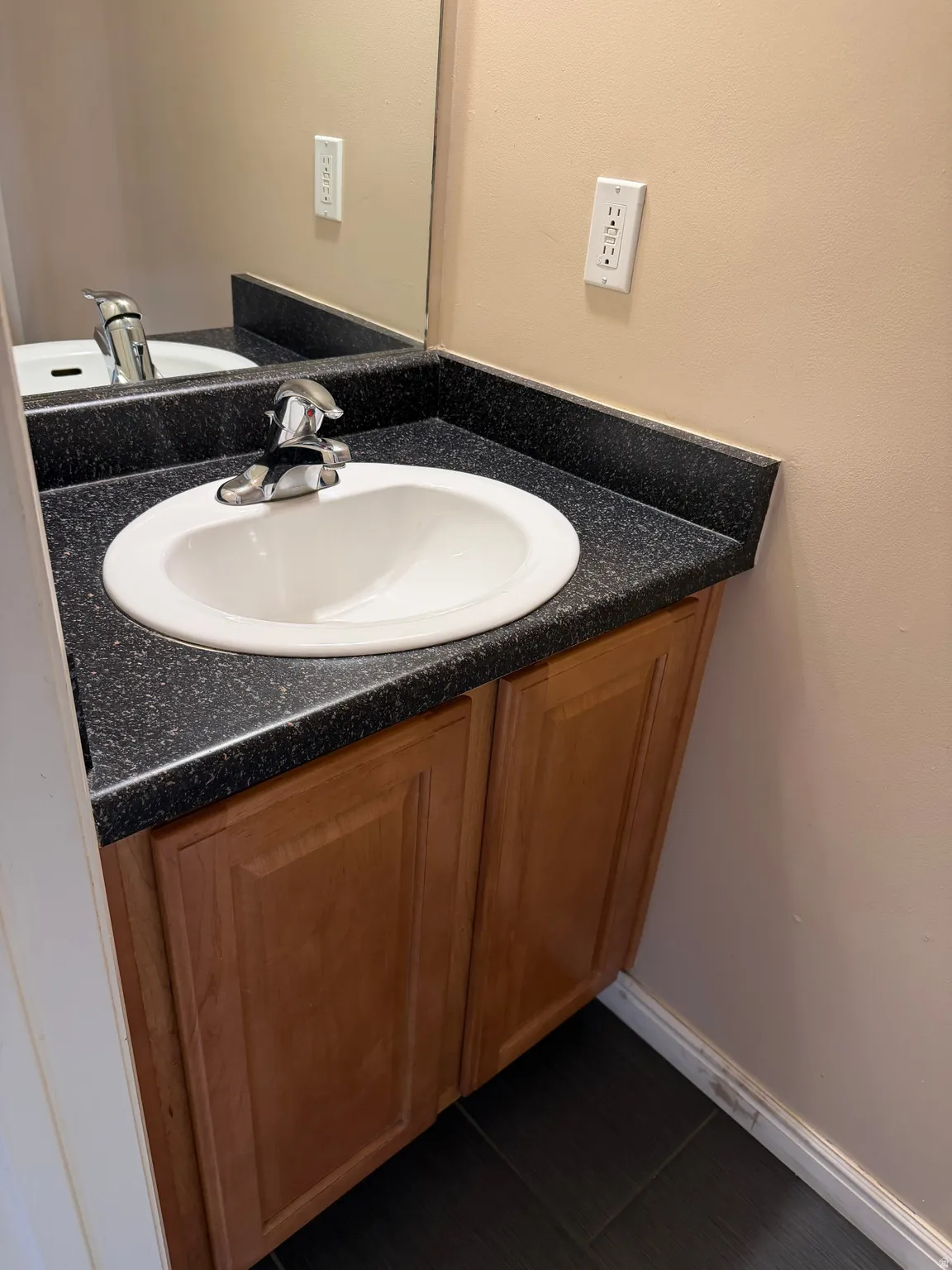 Bathroom featuring vanity and baseboards