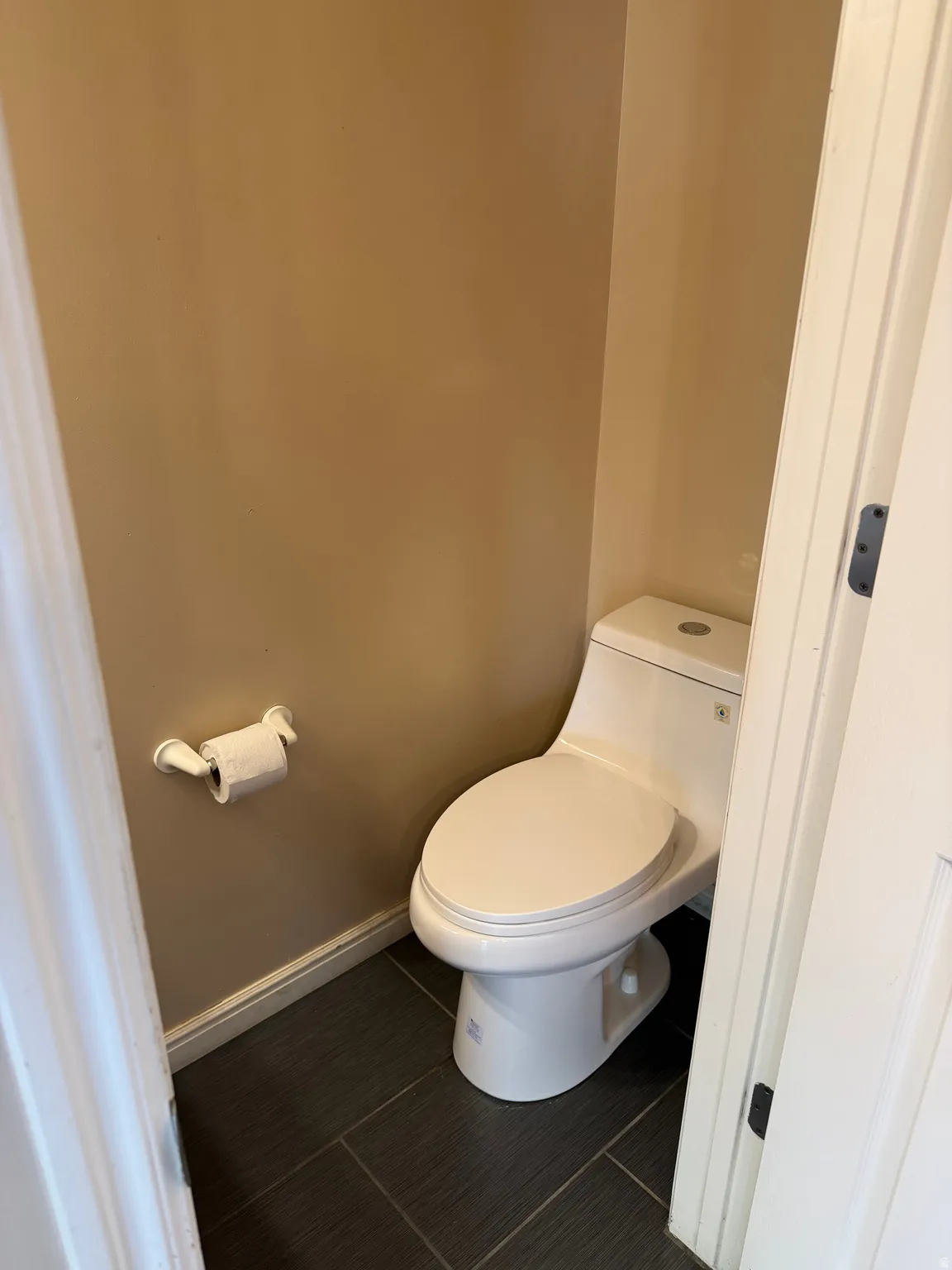 Bathroom featuring baseboards and toilet