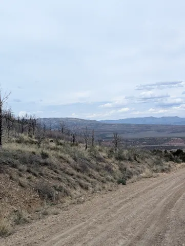Looking Northwest at property. View of Tabby Mtn and Uintahs.